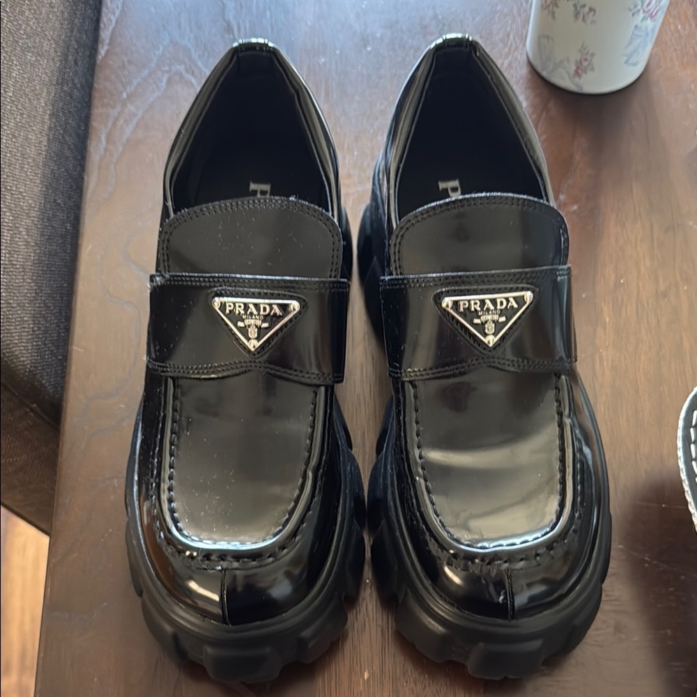 “Prada” Lug Sole Monolith Black Loafers